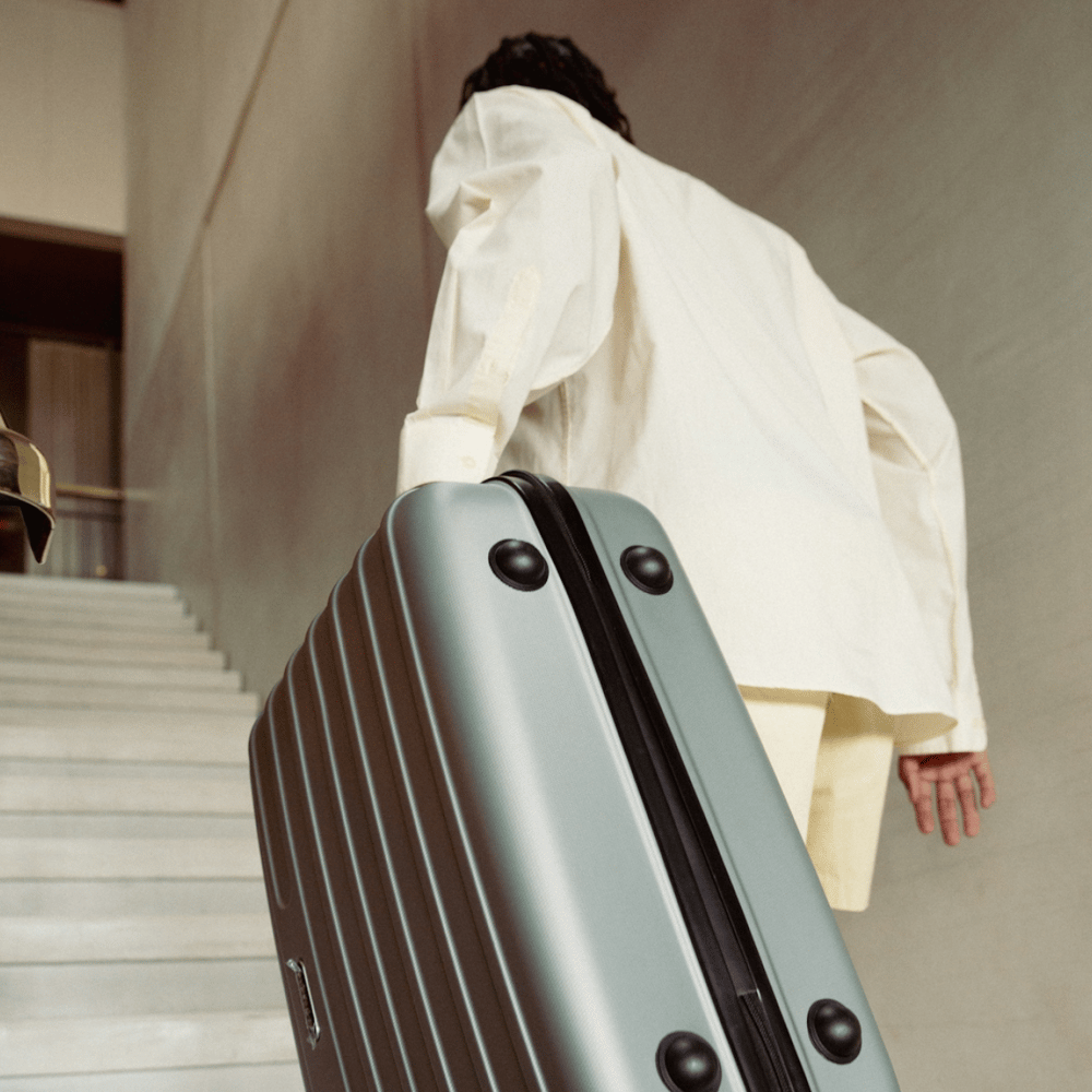 a man carrying a luggage
